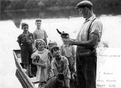 Harry Pope shows children an eel