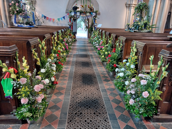 aisle decorated by flowers during the festival